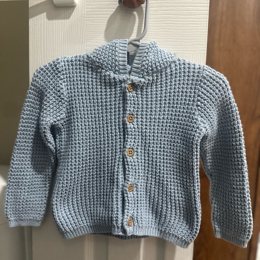 Baby blue knitted sweater with ears on hood